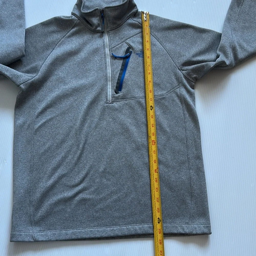 The North Face Men’s gray quarter zip with blue details.  Size medium